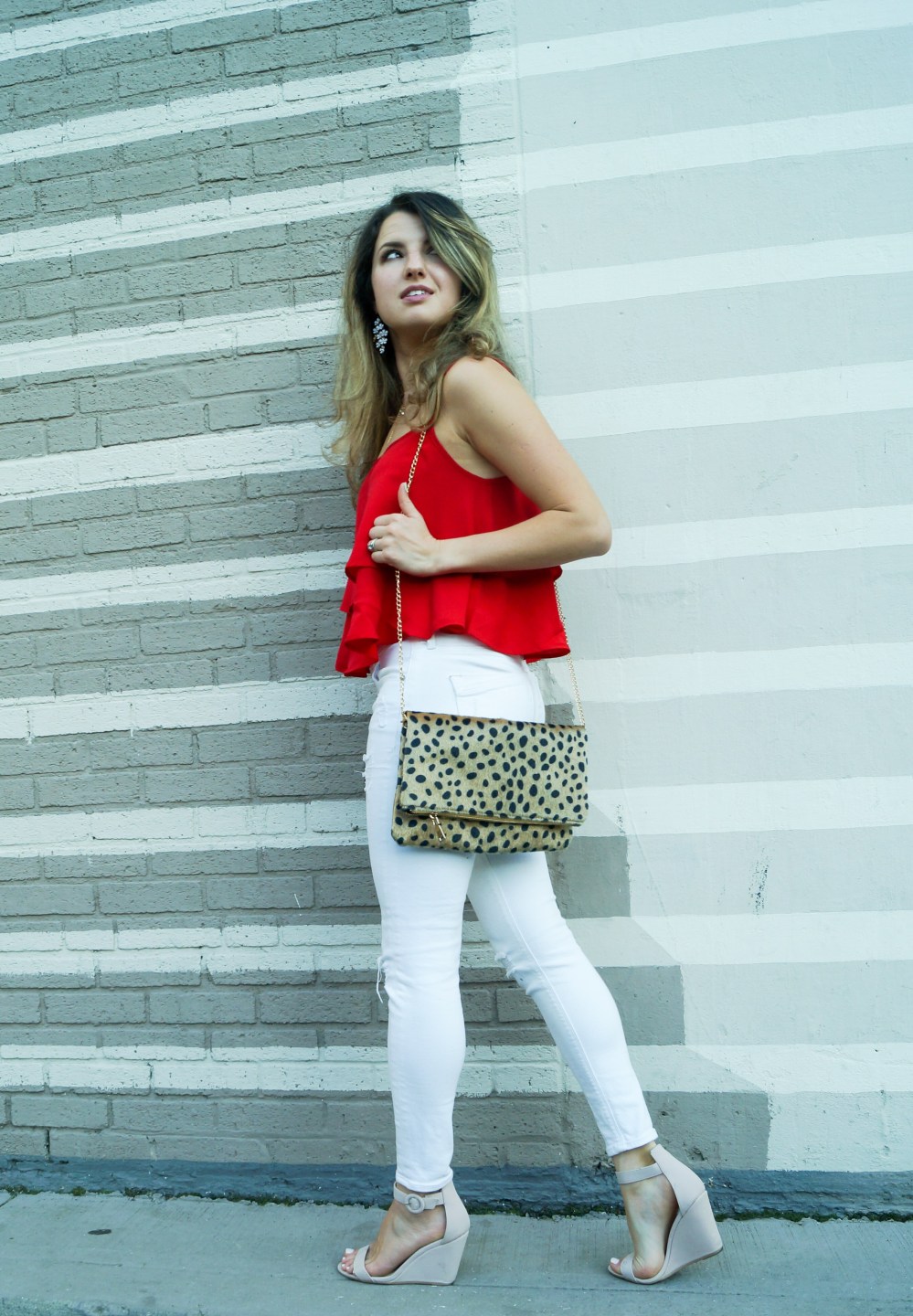 White jeans, red cami and cheetah print clutch